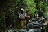 Guided ATV tour on jungle trail, rider with helmet