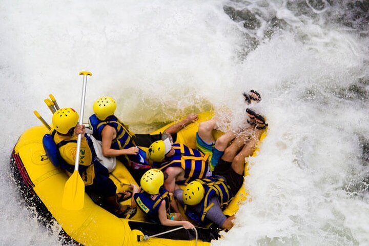 Raft dropping into whitewater on the Telaga Waja River in Bali