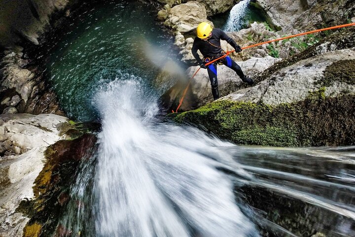 Guests in helmets and wetsuits canyoning in Bali