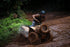 ATV ride through tropical jungle, splashing mud