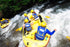 Rafting team paddling the Telaga Waja River rapids