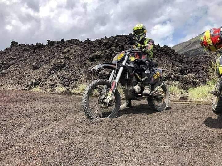 Enduro motorcycle rider on Bali off-road trail