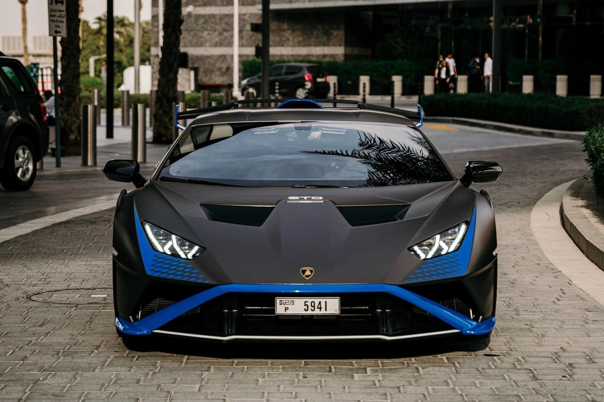 Experience the thrill of a 2022 Lamborghini Huracan STO Black Matt in Dubai. This luxury supercar boasts 640 horsepower, accelerates from 0 to 100 km/h in 2.8 seconds, and reaches a maximum speed of 310 km/h. With automatic transmission, feel the adrenaline on Dubai's roads. Enjoy an intimate driving experience with two seats for exclusivity.