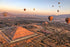 Hot air balloon experience over Teotihuacán, City of Gods, near Mexico City. Includes buffet, transportation. Witness sunrise over pyramids of Moon and Sun. 1-hour flight, brunch, and return to Mexico City. Departure from Ángel de la Independencia at 4:30 AM. Dress warmly."